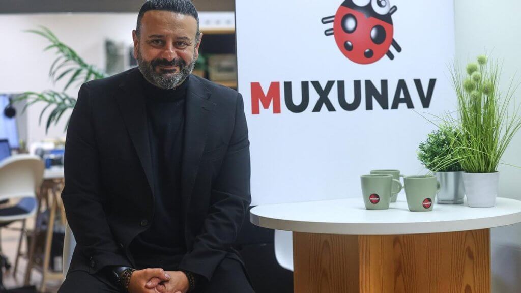 Antonio Torres next to the ladybird logo